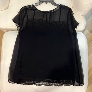 No tag, black blouse with lace appliqué on bottom and across chest.